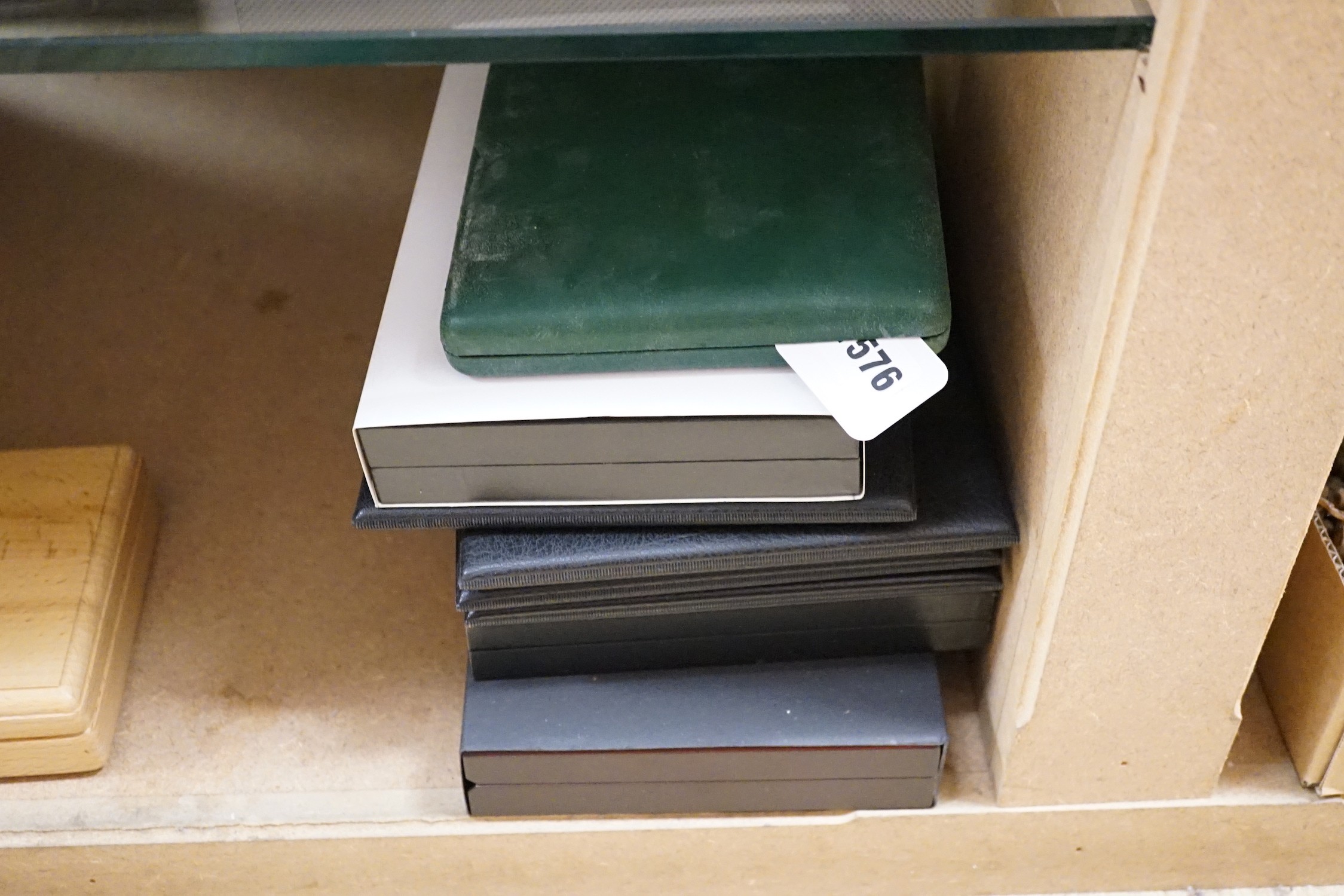 A group of boxed collector's coins